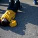 Huron High School supporter Craig Campbell rests on the ground during an award ceremony on Saturday. Daniel Brenner I AnnArbor.com